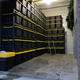 Version 3. Matching shelves will go along the other wall, and a third row will go in the middle leaving two sepperate lanes for grabbing/storing as needed.